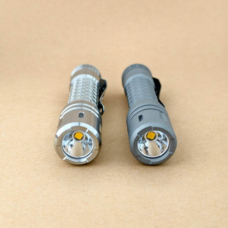 Front view of Raw and Stonewashed LAN Ti Seigaiha flashlights showing LEDs and reflectors
