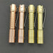 Four ReyLight Pineapple Mini Copper tactical flashlights with clip attachments, displayed side by side in copper finishes.