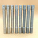 Seven metallic cylindrical penlights, including the ReyLight Pineapple Mini Penlight - TI with textured grips, stand upright in a row against a plain light brown background. One resembles a rechargeable 500-lumen flashlight or penlight.