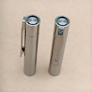 The ReyLight Pineapple Mini Titanium MK3 - Cylinder stands upright on a plain, light brown surface.