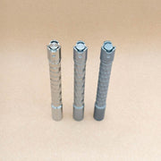 Angled view of three titanium Krystal penlight tail buttons and sculpted tailcaps