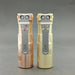 Two Reylight Rook - Brass lighters, one in brass and the other in Nichia 519a, placed on a grey surface.