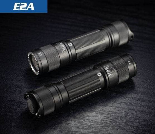Black and gun metal gray Skilhunt E2A flashlights showing the textured aluminum bodies