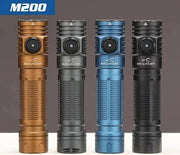 Four Skilhunt M200 V4 compact flashlights in brown, gray, blue, and black stand upright against a neutral background, showcasing their sleek design and handy magnetic charging.