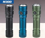 Three Skilhunt M300 V4 flashlights, 3000 Lumens LED models, stand upright in black, blue, and green against a neutral background.