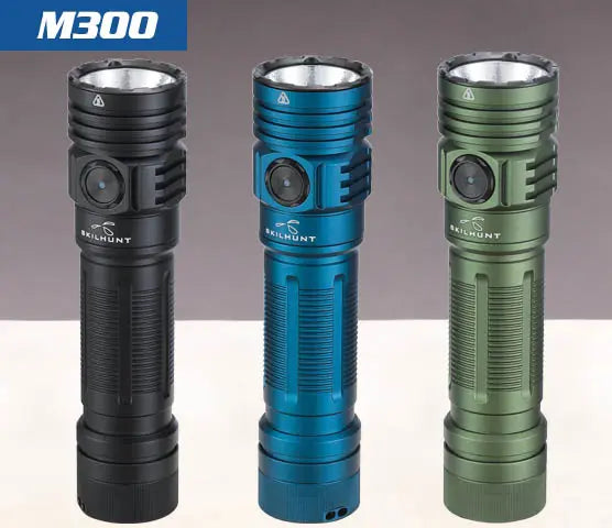 Three Skilhunt M300 V4 flashlights, 3000 Lumens LED models, stand upright in black, blue, and green against a neutral background.
