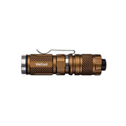 A compact, bronze-colored Weltool BB3 flashlight body (no tailcap) with a textured grip and pocket clip, designed for use with an 18650 battery, is shown against a plain white background.