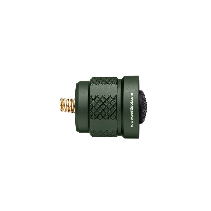 The Weltool TC70 Tailcap is a small, cylindrical, green metal accessory with a textured grip, visible spring, and web address on the side. It's compatible with Surefire E series weapon lights and shown isolated on a white background.