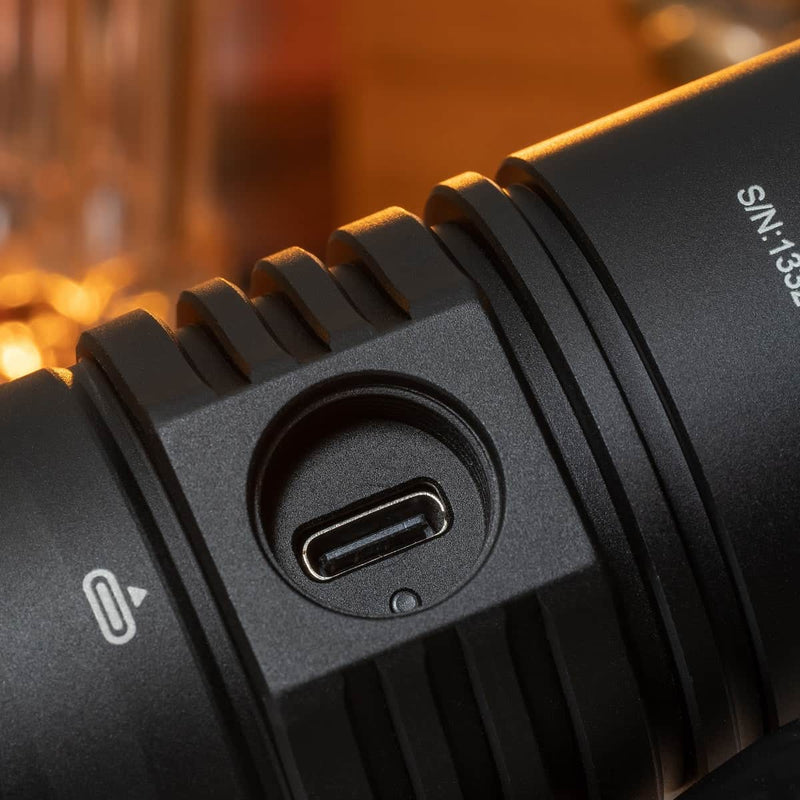 Close-up of the Weltool F9R shows its black casing with a USB-C fast charging port and part of the serial number.