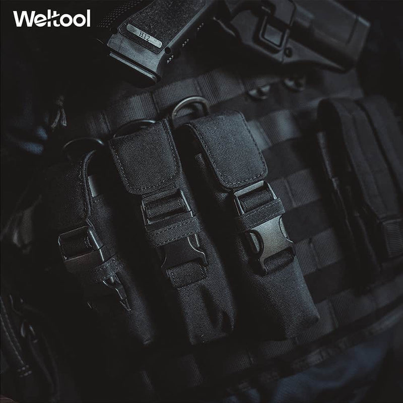 Close-up of a tactical vest with three black pouches, the Weltool FH1 FH2 V2.0 CORDURA Flashlight Holster, and a holstered handgun. The Weltool logo appears in the top left corner.