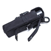 The Weltool FH1 FH2 V2.0 CORDURA Flashlight Holster, with a belt loop, snap closure, and carabiner, holds a black flashlight and is shown on a white background.