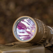 Close-up of the Weltool LH8 V2 Light Head on a textured surface, showcasing its LED bulb. It delivers reliable performance powered by a rechargeable lithium-ion battery.