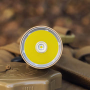 Close-up of the Weltool LH8 V2 Light Head and its front LED, set against a blurred brown and tan background.