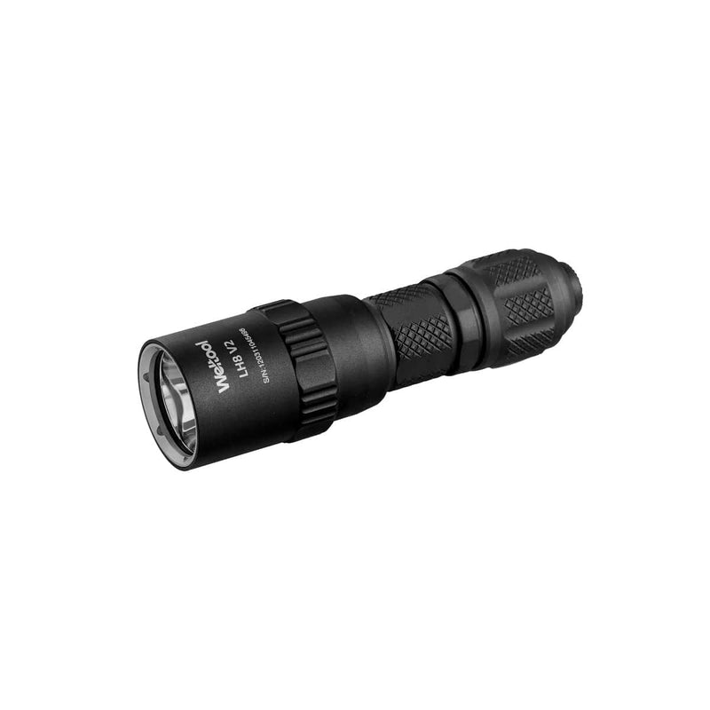 The Weltool T16B V2 tactical flashlight is shown against a white background, featuring a compact, portable design with a textured grip and Weltool branding on the side. This high-lumen flashlight delivers exceptional brightness while maintaining its sleek profile.