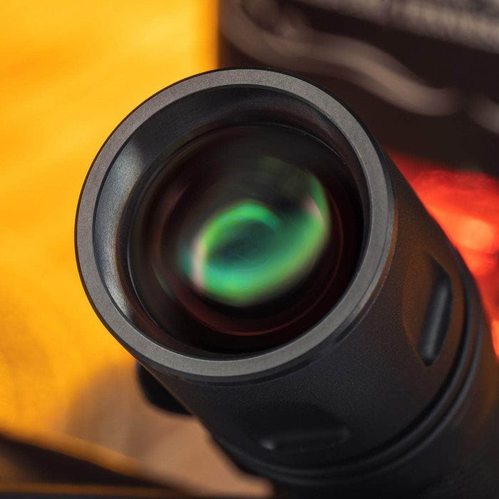 A close up of a Weltool W2 camera lens with a green light.