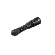 Weltool W3Plus LEP Tactical Flashlight with a textured grip and a beveled end, laying on a white background, delivering 940 lumens of ultra-long-range illumination.