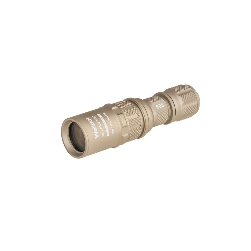 A Weltool W3Pro TAC Mini - FDE compact flashlight in a tan finish is shown isolated on a white background, featuring a textured grip and its lens facing left.