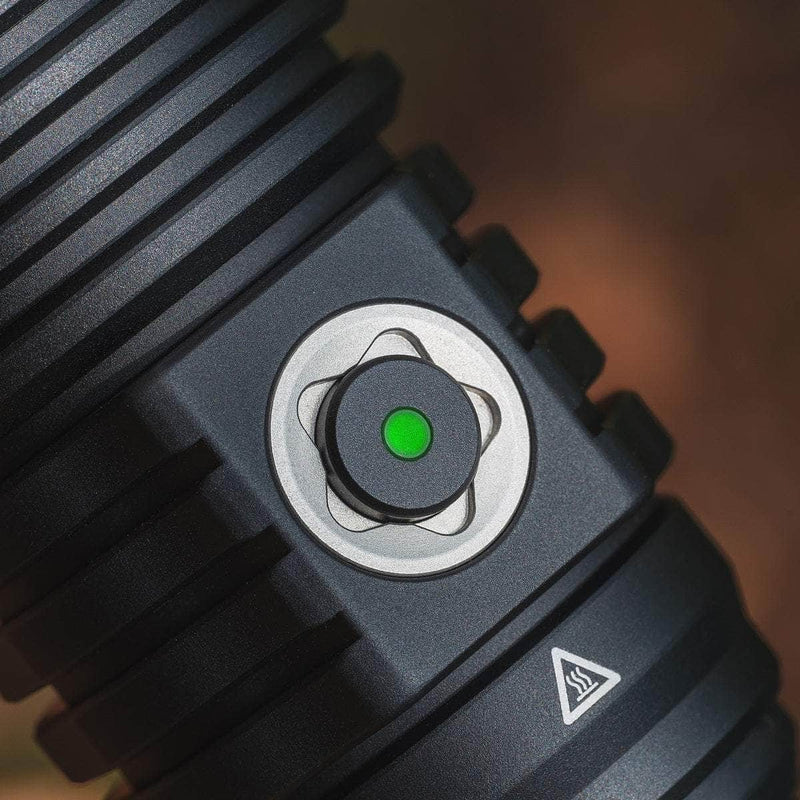 Close-up of the Weltool W5R Pro LEP flashlight's black power button with a green indicator light, metallic ring, and textured grip, featuring waterproof USB-C charging for reliable performance.