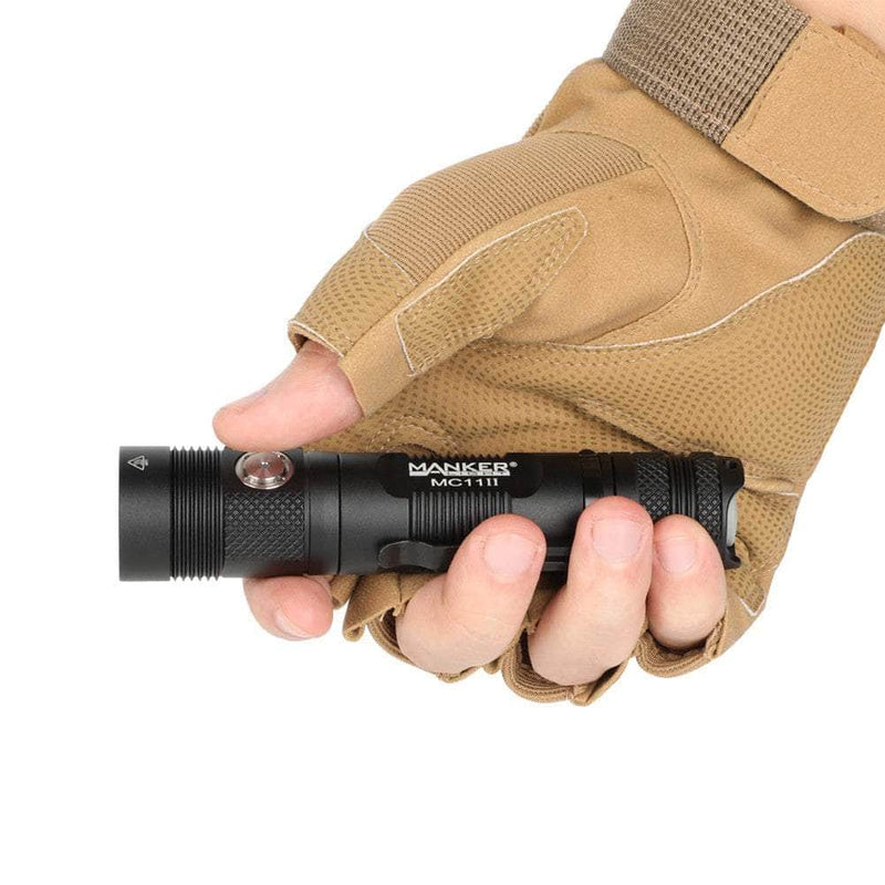 A person holding a Manker MC11 II in their hand.