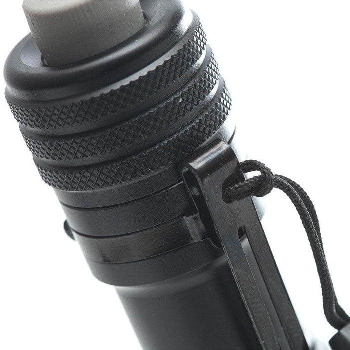 A close up image of a Manker MC12 II flashlight.