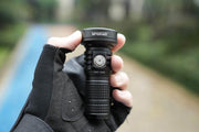 A person holding a Manker MC13 II in their hand.