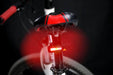 A bicycle with a Manker ML01 light on the handlebars.