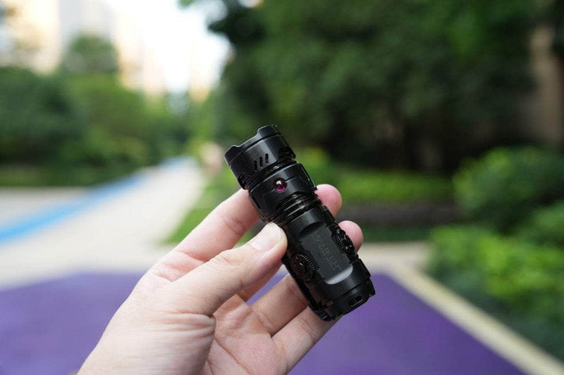 A person holding a Manker Timeback III in their hand.