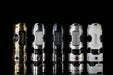 A group of different colored Manker Timeback III lined up on a black background.