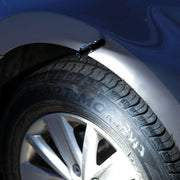 A close up of a Manker E02 II tire with a tire iron.