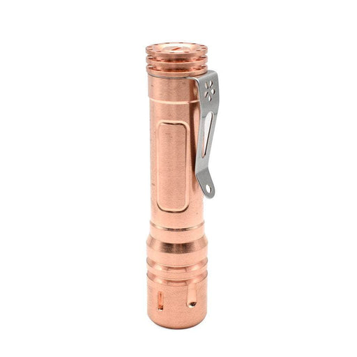 A ReyLight LAN Copper flashlight with a metal handle on a white background.