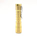 A ReyLight Pineapple Brass flashlight on a white background.