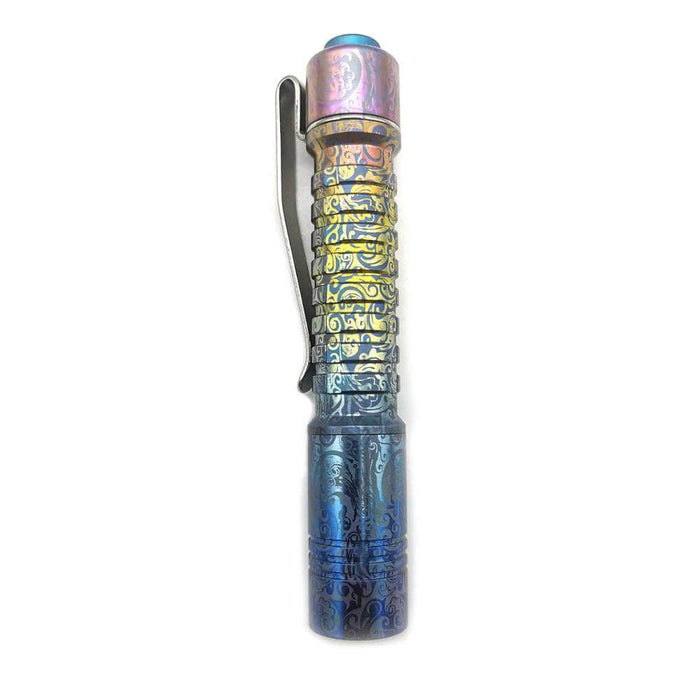 A blue ReyLight Pineapple Mini Titanium Anodized flashlight with a black handle on a white background.