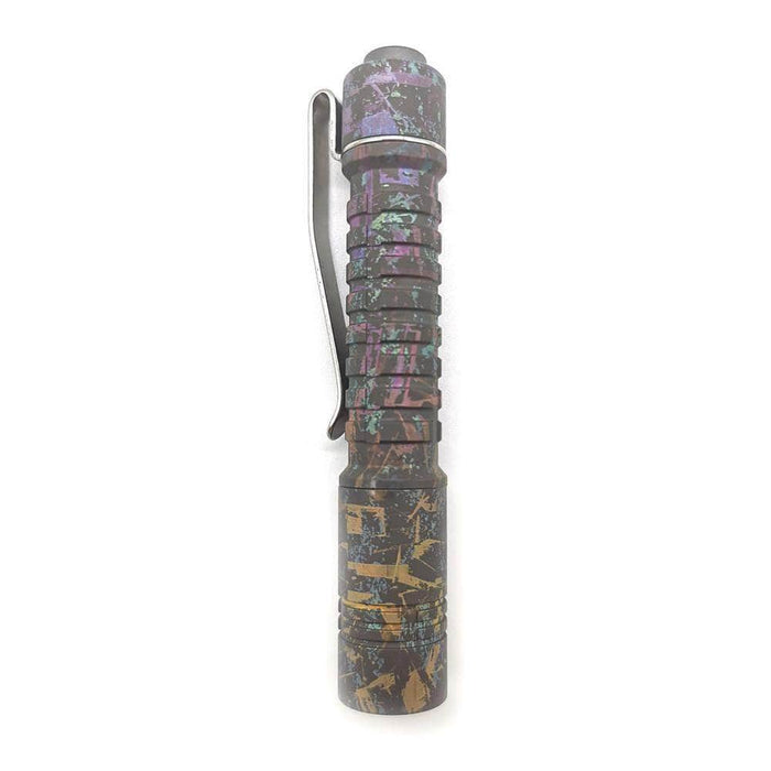 A ReyLight Pineapple Mini Titanium Anodized flashlight with a colorful pattern on it.