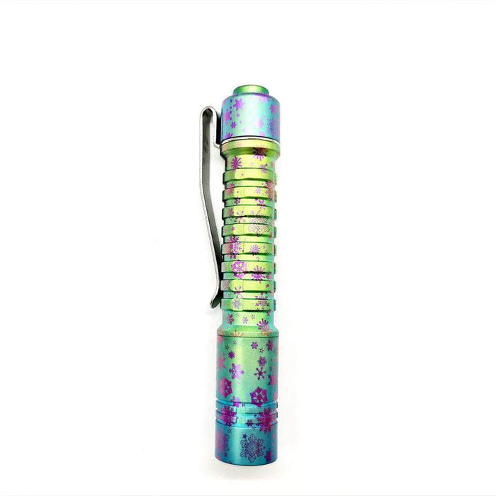 A ReyLight Pineapple Mini Titanium Anodized with a colorful design on it.